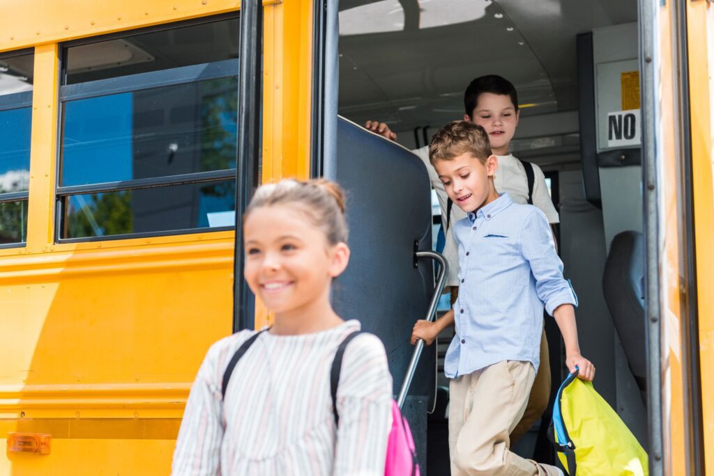 Children getting off school bus